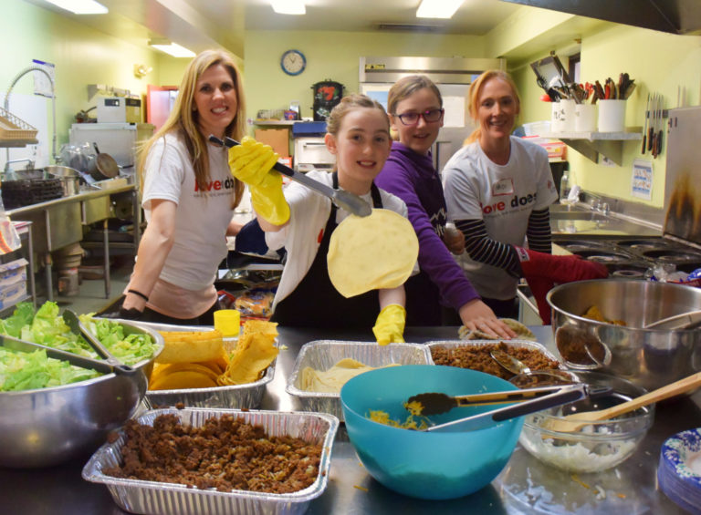 volunteers serving dinner
