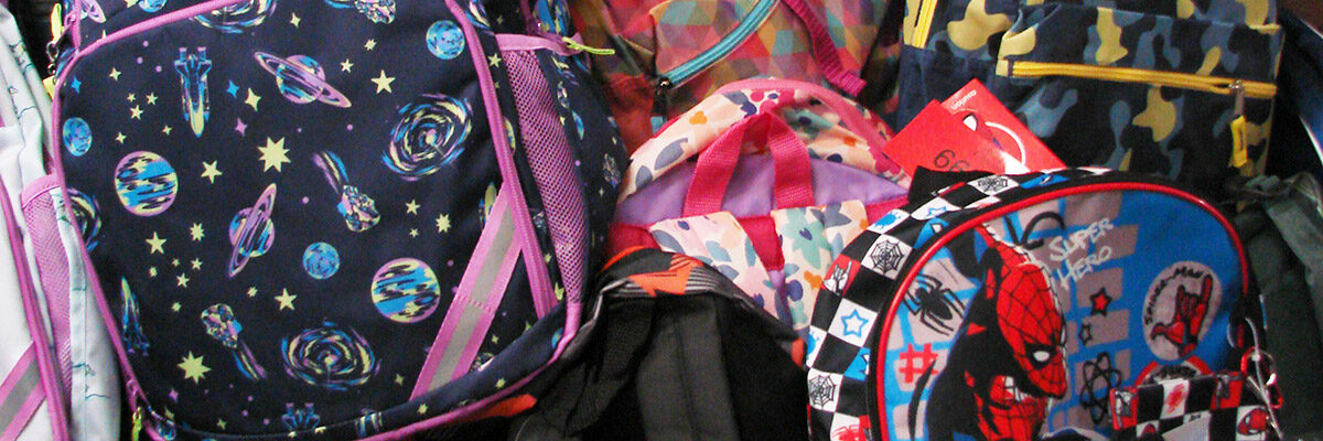 pile of colorful children's backpacks